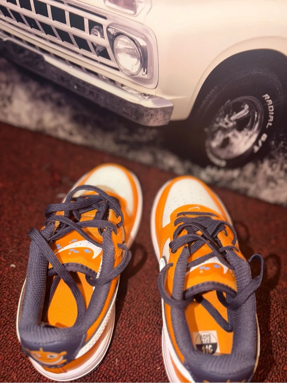 Nike Kids Orange and Gray Low-Top Sneakers with Smiley Heel